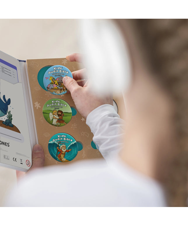 Child in a white shirt holds the ONANOFF Bible Stories Old Testament open, revealing Kids' Audio Bible StoryShields with biblical illustrations.