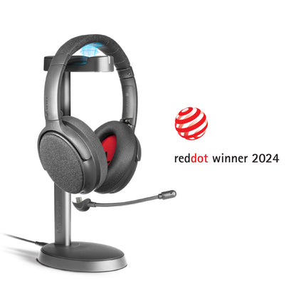A midnight blue ONANOFF wireless ANC Bluetooth headphones with a detachable boom microphone sits on a stand, set against a clean white background. Winner of the RedDot Award 2024